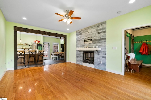 1847 Bertha Knight Rd, Lancaster, SC 29720 - living area featuring ceiling fan, wood finished floors, a stone fireplace, baseboards, and recessed lighting