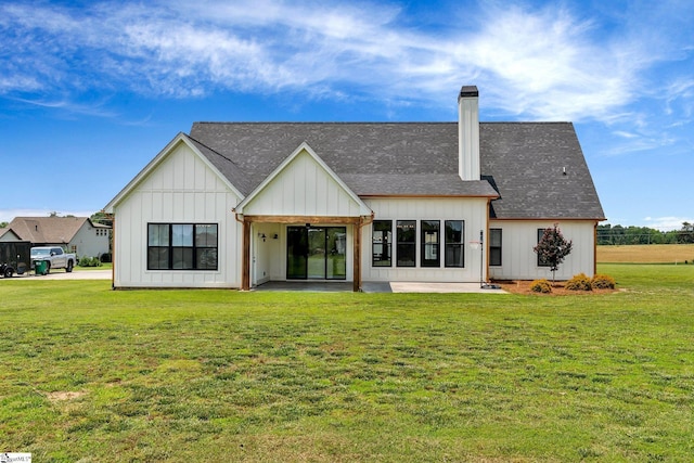 110 Chicken Foot Creek Rd, Woodruff, SC 29388 - back of house featuring a patio, a lawn, a chimney, and a shingled roof