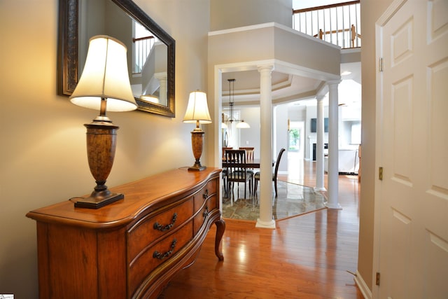 10 Bamburgh Brae Ct, Simpsonville, SC 29681 - corridor featuring ornate columns, wood finished floors, and a high ceiling