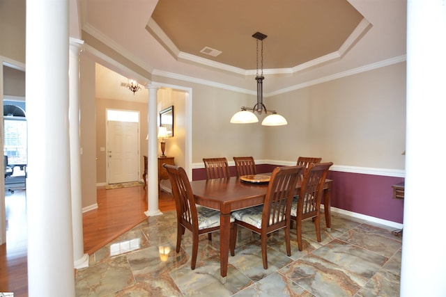 10 Bamburgh Brae Ct, Simpsonville, SC 29681 - dining room featuring ornate columns, a tray ceiling, crown molding, marble finish flooring, and baseboards
