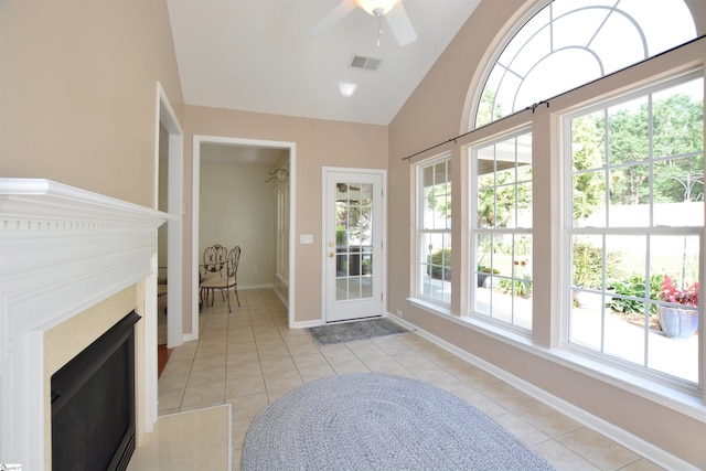 10 Bamburgh Brae Ct, Simpsonville, SC 29681 - foyer entrance featuring a fireplace, light tile patterned floors, vaulted ceiling, ceiling fan, and baseboards