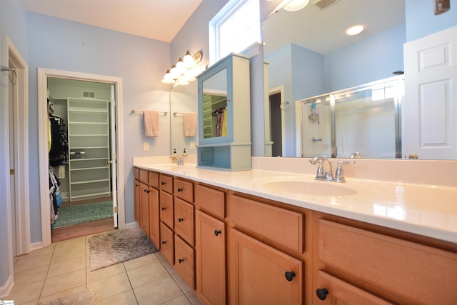 10 Bamburgh Brae Ct, Simpsonville, SC 29681 - bathroom with double vanity, a walk in closet, a stall shower, and tile patterned floors