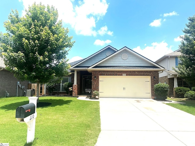 220 Scottish Ave, Simpsonville, SC 29680 - view of front facade with a garage, concrete driveway, brick siding, and a front yard