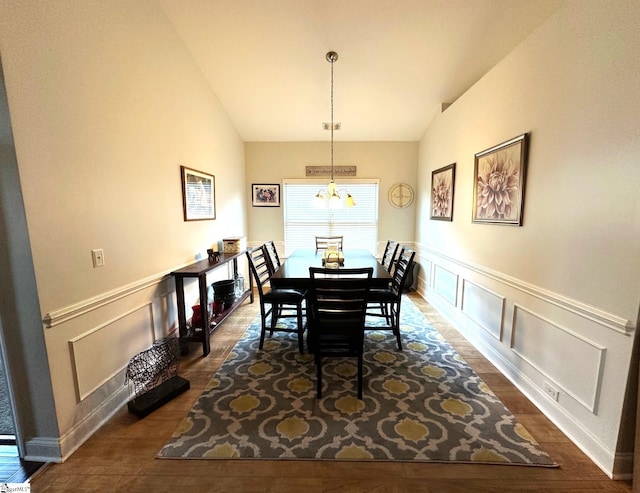 220 Scottish Ave, Simpsonville, SC 29680 - dining room with lofted ceiling, dark wood finished floors, a chandelier, a decorative wall, and wainscoting