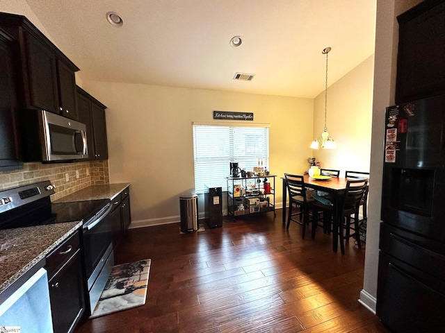 220 Scottish Ave, Simpsonville, SC 29680 - kitchen with stainless steel appliances, tasteful backsplash, dark wood finished floors, vaulted ceiling, and recessed lighting