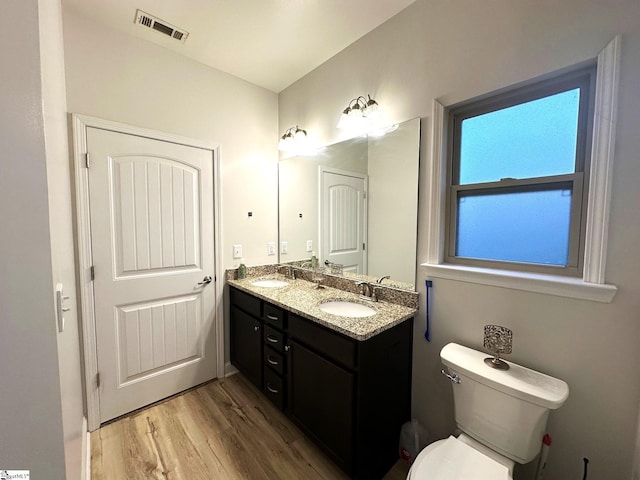 220 Scottish Ave, Simpsonville, SC 29680 - bathroom featuring wood finished floors, double vanity, and toilet