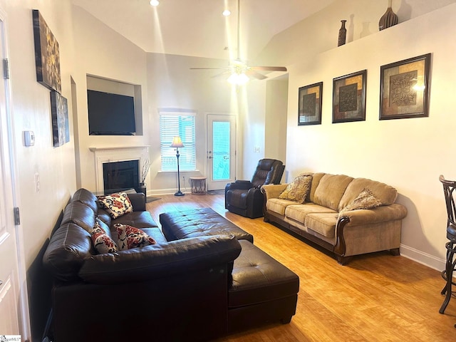 220 Scottish Ave, Simpsonville, SC 29680 - living room featuring ceiling fan, light wood finished floors, baseboards, a fireplace, and high vaulted ceiling