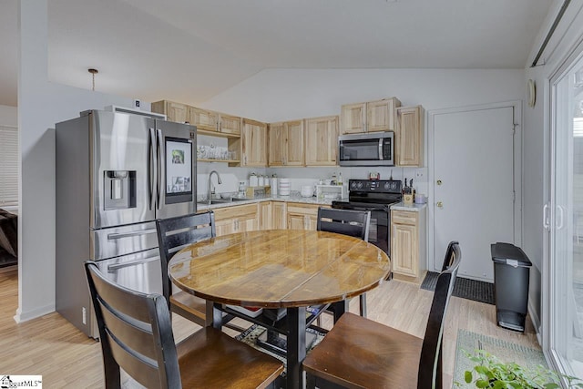 710 Amy Gray St, Greer, SC 29651 - kitchen featuring stainless steel appliances, light brown cabinets, light wood-style floors, and lofted ceiling