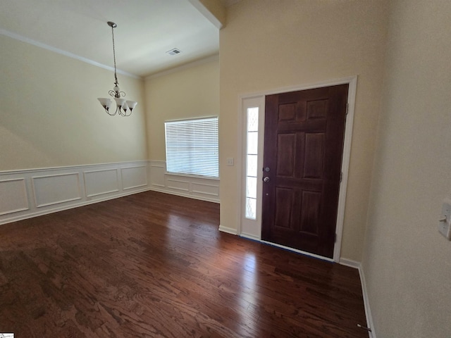 605 Spirit Mountain Ln, Easley, SC 29642 - entryway with crown molding, a chandelier, dark wood-style flooring, and wainscoting
