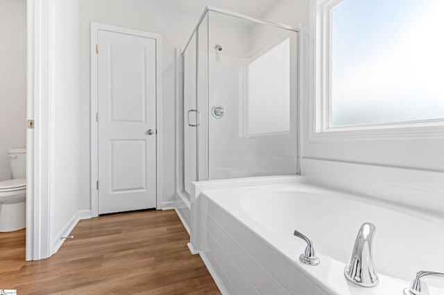 474 Grantham Ct, Spartanburg, SC 29303 - bathroom featuring a shower stall, a bath, toilet, and wood finished floors