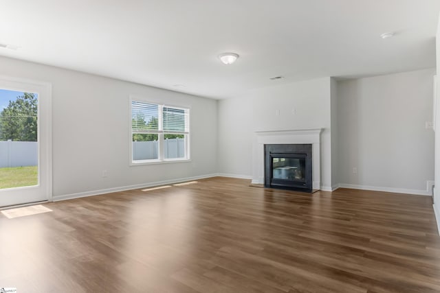 474 Grantham Ct, Spartanburg, SC 29303 - unfurnished living room featuring wood finished floors, a fireplace, and baseboards