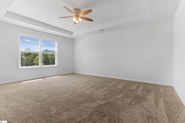 474 Grantham Ct, Spartanburg, SC 29303 - carpeted empty room featuring a tray ceiling, ceiling fan, and baseboards