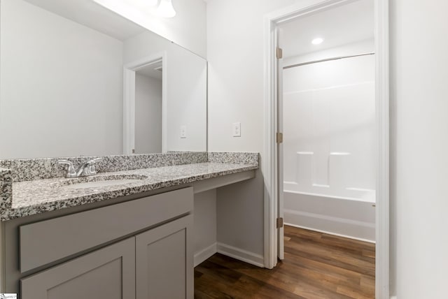 474 Grantham Ct, Spartanburg, SC 29303 - bathroom featuring vanity, wood finished floors, baseboards, and tub / shower combination
