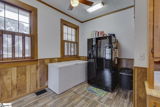 5 Alabama St, Honea Path, SC 29654 - laundry area with a wainscoted wall, wooden walls, ornamental molding, and ceiling fan