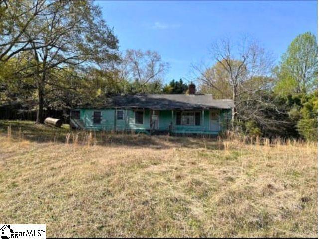 130 Poplar St, Pacolet, SC 29372 - ranch-style home with a front yard and a chimney