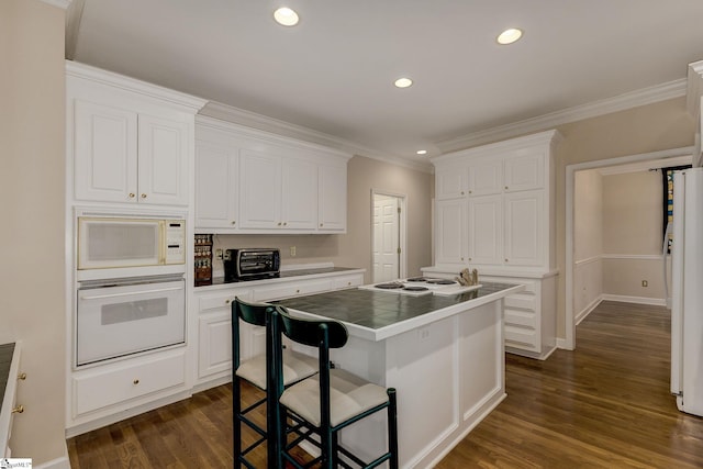 1004 Neely Farm Dr, Simpsonville, SC 29680 - kitchen with white appliances, tile countertops, ornamental molding, white cabinetry, and dark wood finished floors