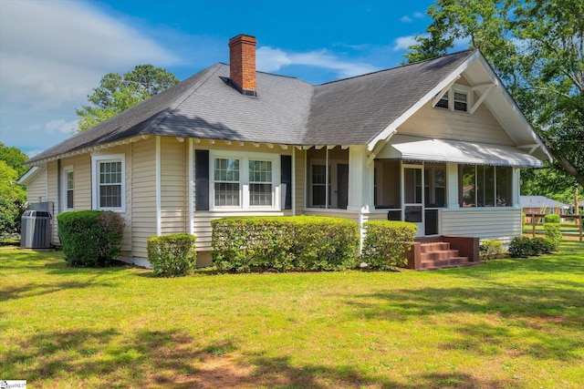 2100 Marchbanks Ave, Anderson, SC 29621 - view of front of house with central air condition unit, a chimney, a front lawn, and a shingled roof