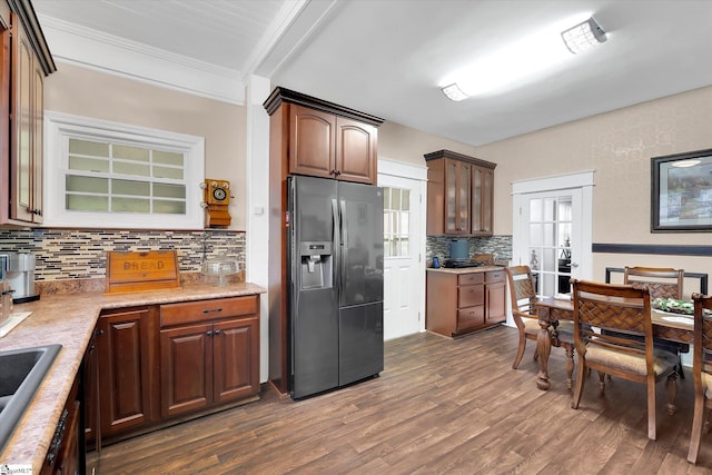 2100 Marchbanks Ave, Anderson, SC 29621 - kitchen with stainless steel refrigerator with ice dispenser, tasteful backsplash, dark wood finished floors, light countertops, and ornamental molding