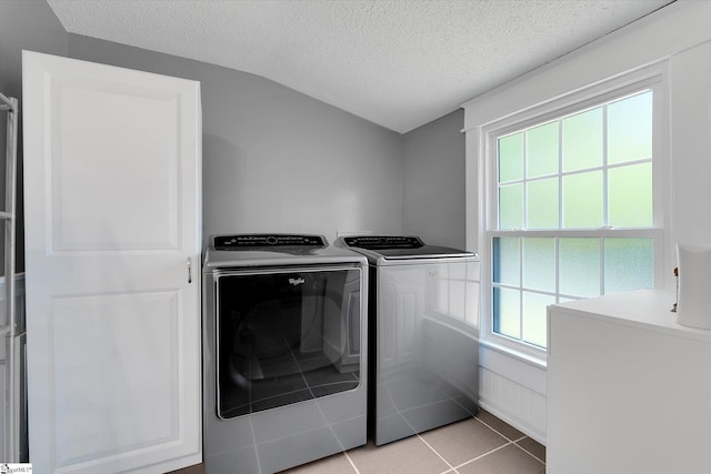 2100 Marchbanks Ave, Anderson, SC 29621 - laundry area featuring washer and clothes dryer, a textured ceiling, healthy amount of natural light, and light tile patterned flooring