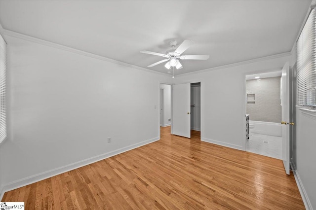 304 Robin Hood Rd, Greenville, SC 29607 - unfurnished bedroom with light wood finished floors, baseboards, ornamental molding, and a ceiling fan