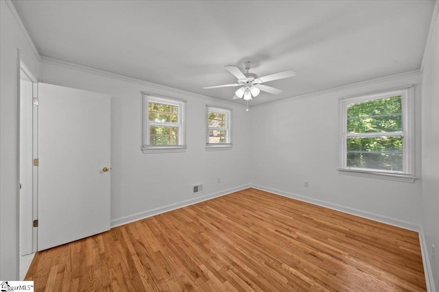 304 Robin Hood Rd, Greenville, SC 29607 - unfurnished bedroom featuring crown molding, light wood finished floors, baseboards, and a ceiling fan