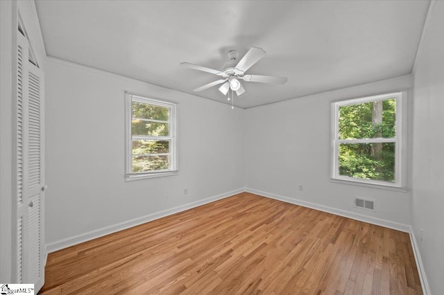 304 Robin Hood Rd, Greenville, SC 29607 - unfurnished bedroom featuring baseboards, light wood finished floors, a closet, a ceiling fan, and crown molding