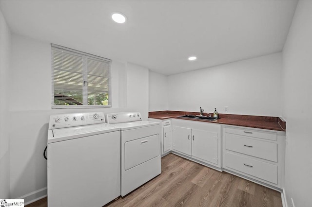 304 Robin Hood Rd, Greenville, SC 29607 - washroom with independent washer and dryer, light wood-style flooring, cabinet space, and recessed lighting