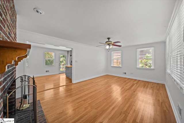 304 Robin Hood Rd, Greenville, SC 29607 - unfurnished living room featuring light wood-style flooring, a ceiling fan, baseboards, and ornamental molding