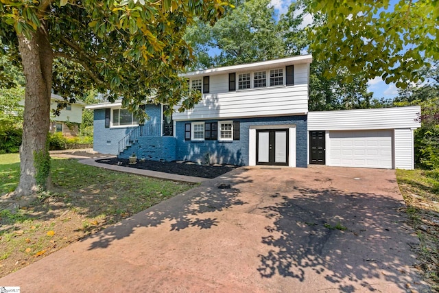 106 Chesterfield Rd, Greenville, SC 29605 - tri-level home with french doors, brick siding, and concrete driveway