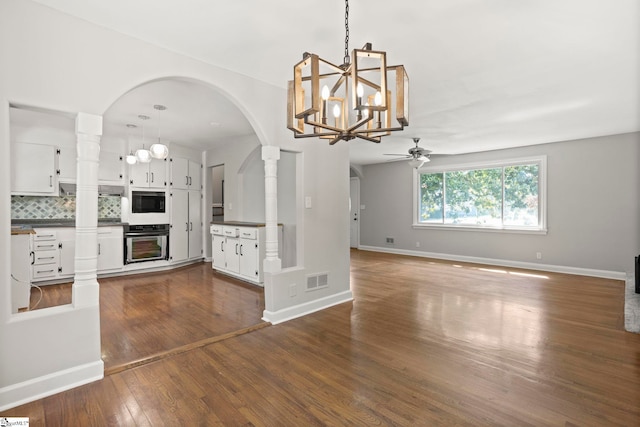 106 Chesterfield Rd, Greenville, SC 29605 - kitchen featuring dark countertops, a chandelier, a ceiling fan, backsplash, and white cabinetry