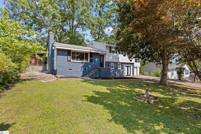 106 Chesterfield Rd, Greenville, SC 29605 - split level home featuring a chimney, a front lawn, brick siding, crawl space, and central air condition unit