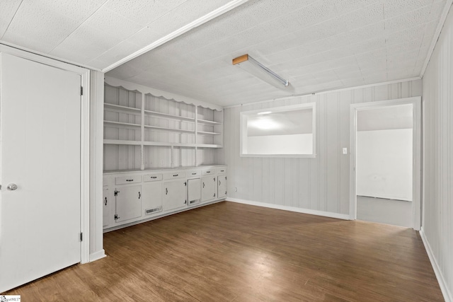 106 Chesterfield Rd, Greenville, SC 29605 - spare room with wood finished floors, baseboards, and built in shelves