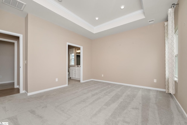 6010 Ives Ave, Spartanburg, SC 29307 - unfurnished bedroom with light carpet, crown molding, baseboards, a tray ceiling, and recessed lighting