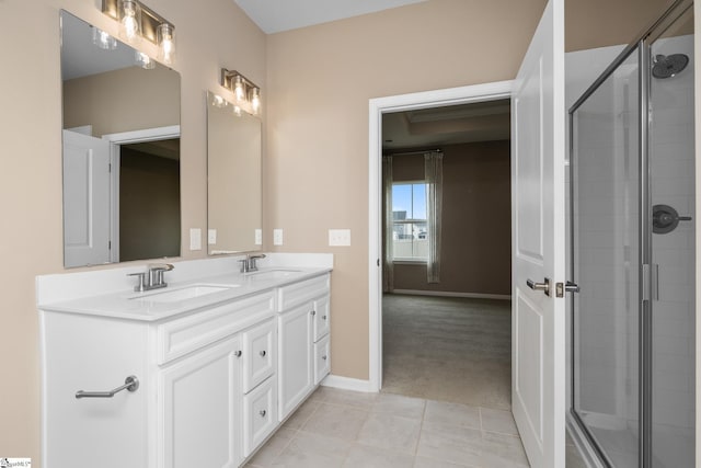 6010 Ives Ave, Spartanburg, SC 29307 - bathroom with double vanity, tiled shower, baseboards, and tile patterned flooring