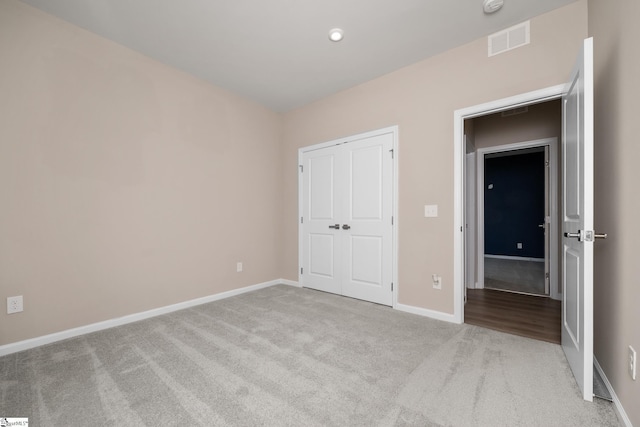 6010 Ives Ave, Spartanburg, SC 29307 - unfurnished bedroom with carpet, baseboards, and a closet