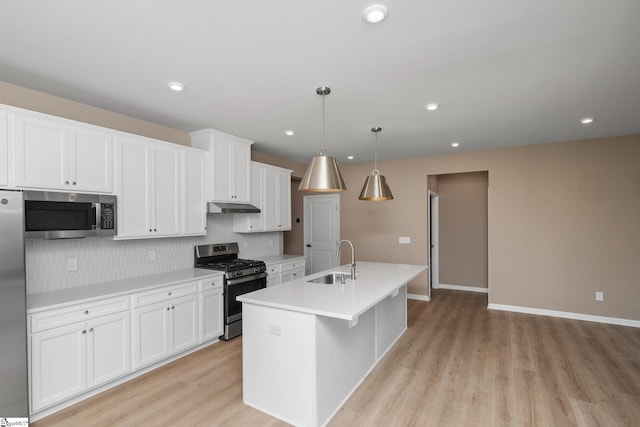 6010 Ives Ave, Spartanburg, SC 29307 - kitchen featuring stainless steel appliances, a sink, backsplash, white cabinets, and recessed lighting