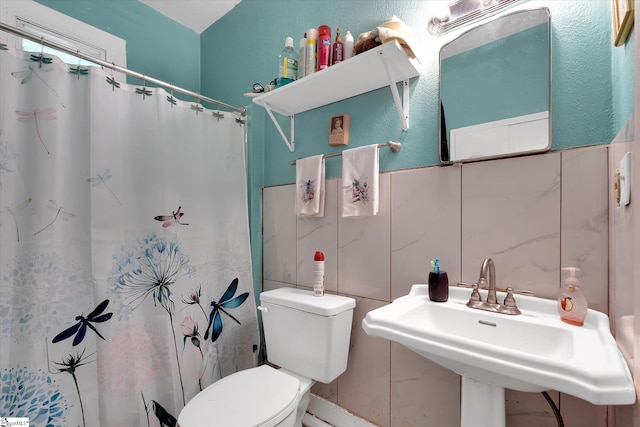 127 Orr St, Piedmont, SC 29673 - bathroom featuring toilet, tile walls, curtained shower, and a sink