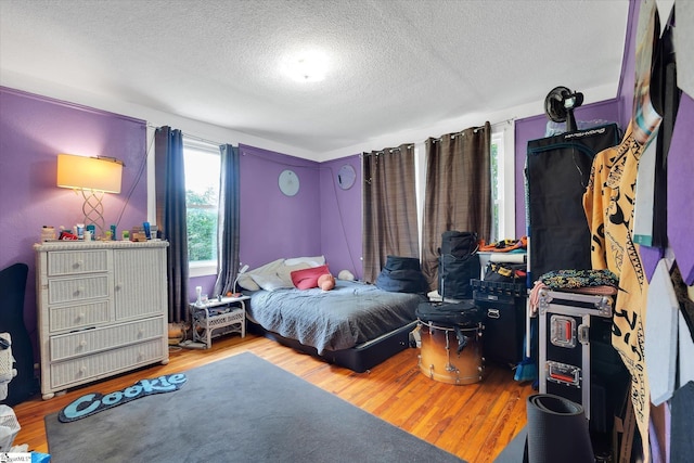 127 Orr St, Piedmont, SC 29673 - bedroom with a textured ceiling and wood finished floors