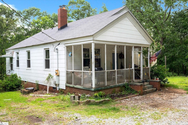 127 Orr St, Piedmont, SC 29673 - back of house featuring a sunroom, a chimney, and roof with shingles