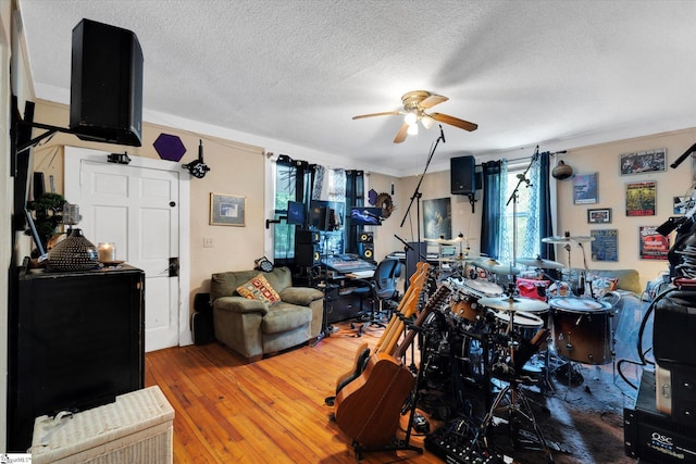 127 Orr St, Piedmont, SC 29673 - living room with ceiling fan, hardwood / wood-style floors, a textured ceiling, and crown molding