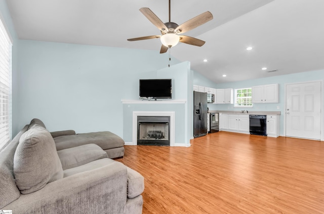 4 Yukon Dr, Greenville, SC 29605 - living room featuring a fireplace, ceiling fan, light wood-style flooring, vaulted ceiling, and recessed lighting