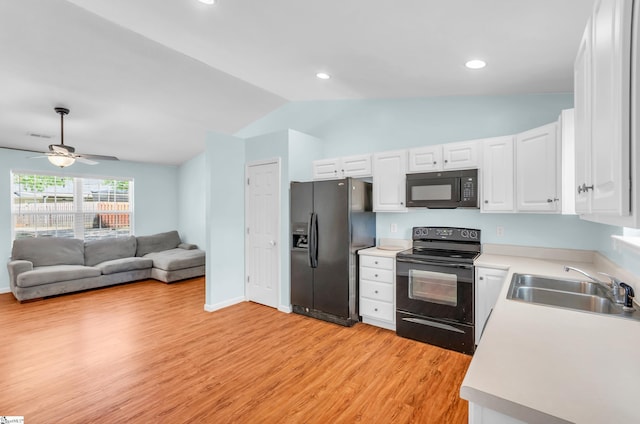 4 Yukon Dr, Greenville, SC 29605 - kitchen featuring black appliances, lofted ceiling, a sink, light countertops, and light wood finished floors