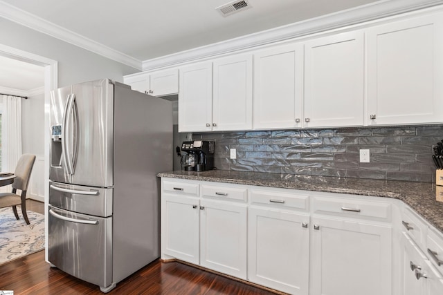 435 Grayson Dr, Moore, SC 29369 - kitchen featuring stainless steel fridge with ice dispenser, crown molding, white cabinets, dark stone countertops, and tasteful backsplash