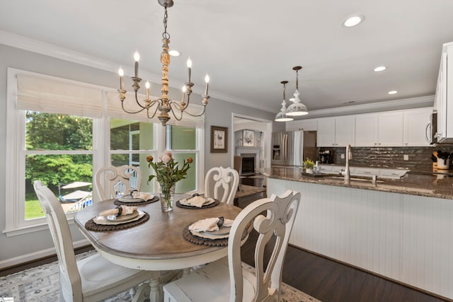 435 Grayson Dr, Moore, SC 29369 - dining area featuring crown molding, healthy amount of natural light, dark wood-type flooring, a chandelier, and recessed lighting