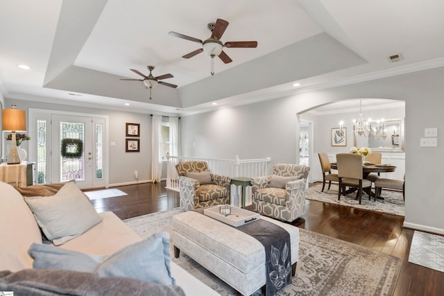 435 Grayson Dr, Moore, SC 29369 - living area with a tray ceiling, ceiling fan, crown molding, a chandelier, and dark wood-type flooring