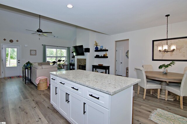 1608 Rock Springs Rd, Lavonia, GA 30553 - kitchen featuring light wood-style floors, a chandelier, a center island, white cabinetry, and recessed lighting
