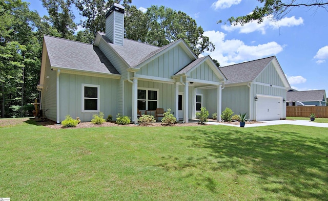 1608 Rock Springs Rd, Lavonia, GA 30553 - view of front of home with a shingled roof, board and batten siding, a garage, a chimney, and driveway