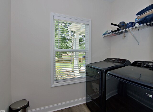 1608 Rock Springs Rd, Lavonia, GA 30553 - washroom featuring separate washer and dryer, baseboards, healthy amount of natural light, and wood finished floors