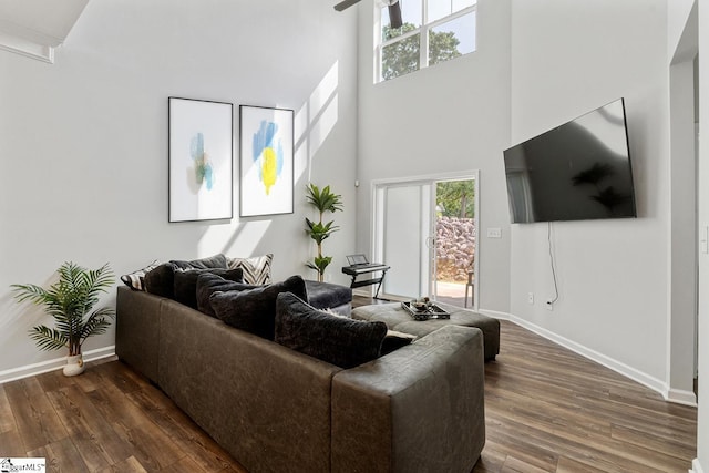 106 Cross Arbor Dr, Simpsonville, SC 29681 - living area featuring a towering ceiling, dark wood-style floors, baseboards, and ceiling fan