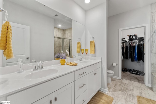 106 Cross Arbor Dr, Simpsonville, SC 29681 - full bathroom with toilet, double vanity, a stall shower, a walk in closet, and baseboards